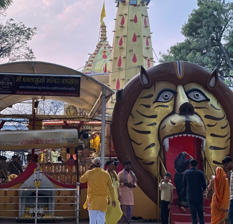 Temple entrance — devotees arriving for Darshan